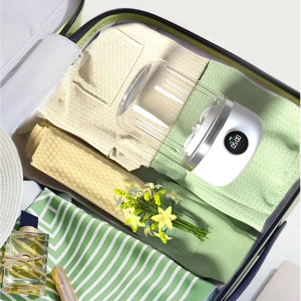 1L compact laundry cleaner by AngShop placed in packed suitcase with folded clothes and flowers