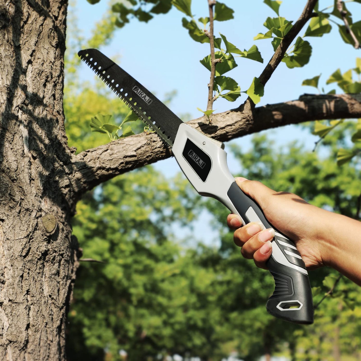 AngShop compact pruning saw cutting a tree branch with ergonomic handle and sharp teeth