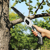 AngShop compact pruning saw cutting a tree branch with ergonomic handle and sharp teeth