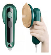 AngShop green compact steam iron for home with ergonomic handle and pointed soleplate held in hand