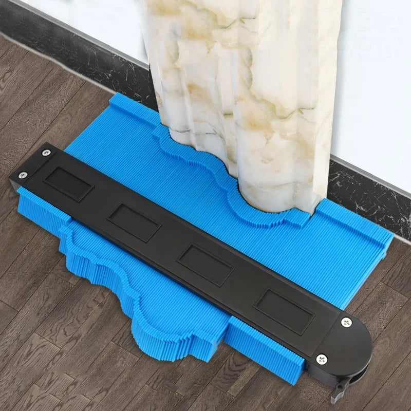 AngShop blue contour gauge tool measuring curved marble column shape on wood floor
