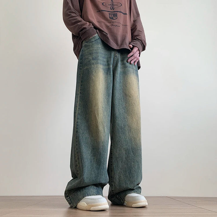 AngShop distressed wide leg jeans in faded blue worn with casual brown long sleeve shirt and white sneakers