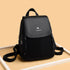 Black functional leather-look backpack for daily use with front flap and adjustable straps
