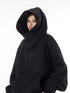 Black Harajuku fashion hoodie unisex with oversized hood and relaxed fit worn by model