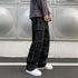 Black casual cargo trousers for men with multiple pockets and white sneakers