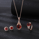Elegant red tourmaline necklace and earrings set with gold and diamond accents from AngShop