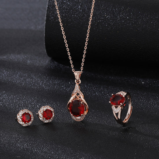 Elegant red tourmaline necklace and earrings set with gold and diamond accents from AngShop