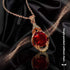 Elegant red tourmaline necklace and earrings pendant with gold setting on black satin background