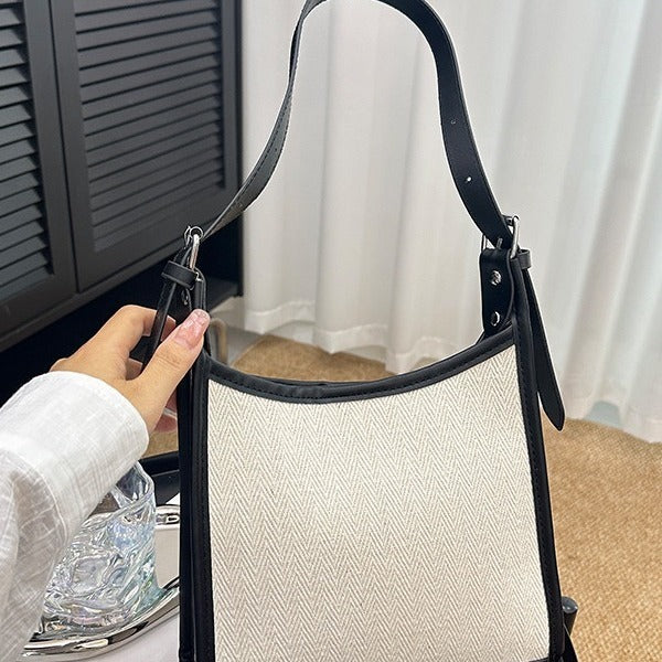 Elegant stitched handbag for women in black and beige with adjustable strap by AngShop