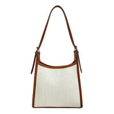 Elegant stitched handbag for women in white fabric with brown leather trim and shoulder strap