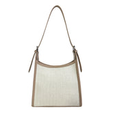 Elegant stitched handbag for women in beige and cream with a single shoulder strap