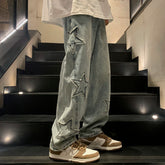 AngShop gray denim gothic streetwear pants with star patches worn with brown and white sneakers