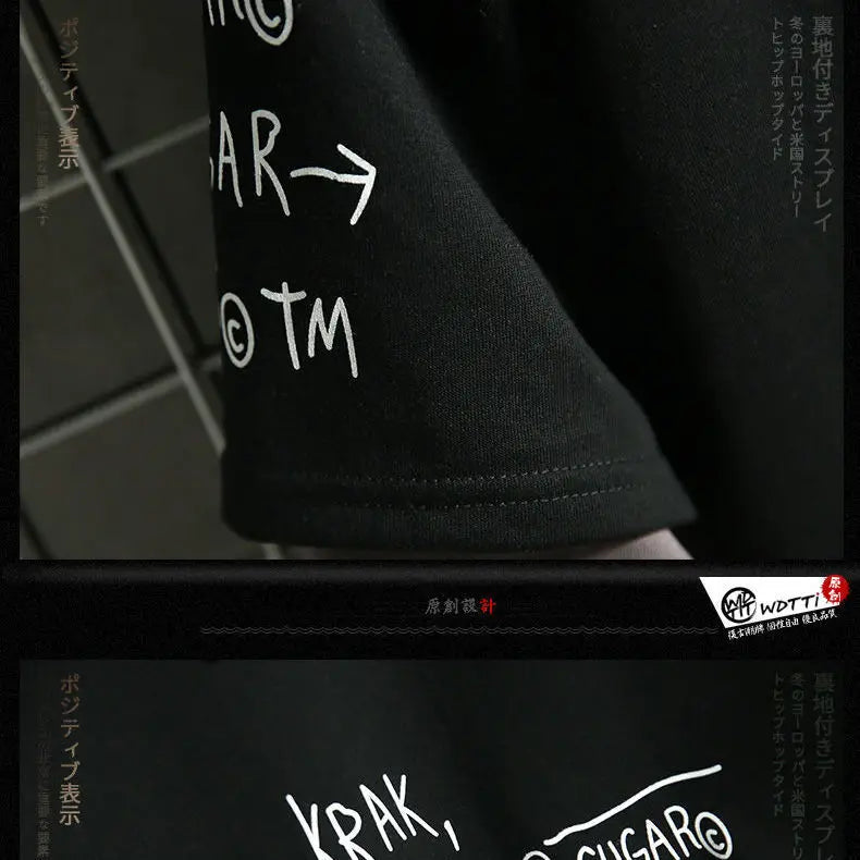 Close-up detail of black fall and spring casual hooded sweater with white printed text design